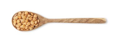 Raw lentils in wooden spoon isolated on white, top view