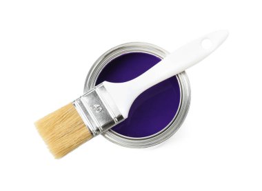Can of purple paint and brush isolated on white, top view