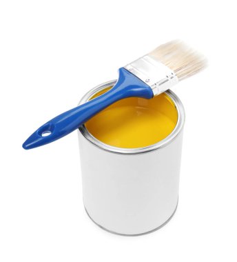 Can of yellow paint and brush isolated on white