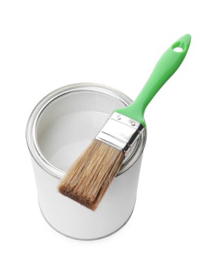 Open can of paint and brush isolated on white