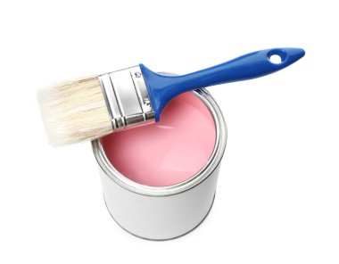 Can of pink paint and brush isolated on white