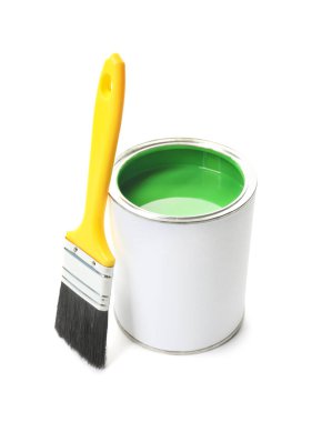 Can of green paint and brush isolated on white