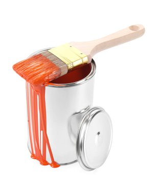 Can of orange paint and brush isolated on white