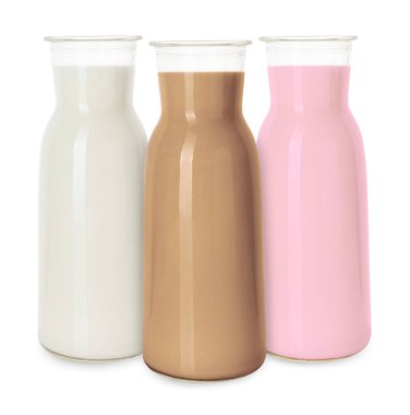 Süt, beyaz sürahilerde izole edilmişti. Vanilya, çikolata ve çilek.