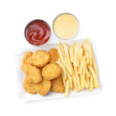 Tasty chicken nuggets and french fries with sauce isolated on white, top view