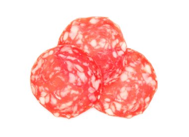 Slices of tasty smoked sausage on white background, top view