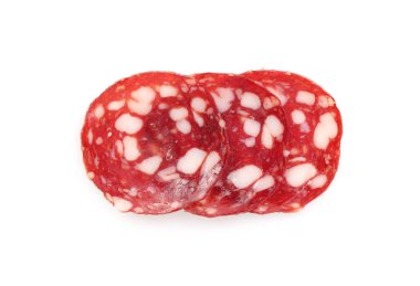 Slices of tasty smoked sausage on white background, top view