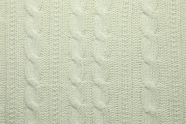 Arka plan olarak örülmüş beyaz yün kumaş, üst görünüm