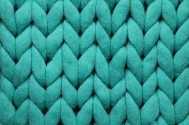Arka plan olarak turkuaz örülmüş yün dokusu, üst görünüm