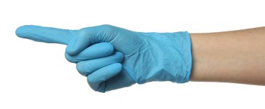 Tıbbi eldivenli doktor beyaz arka planda bir şeyi işaret ediyor, yakın plan.