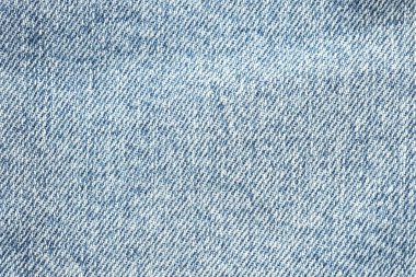 Açık mavi kot kumaşın dokusu arkaplan olarak, üst görünüm