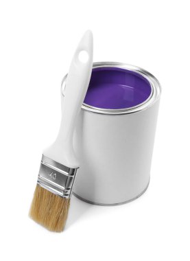 Can of purple paint and brush isolated on white