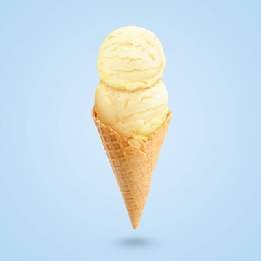 Pastel mavi arka planda waffle külahında servis edilen lezzetli dondurma.