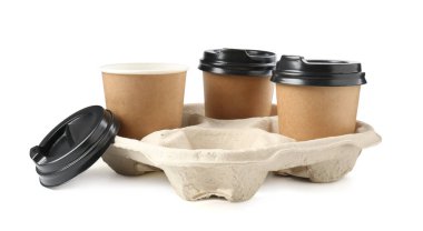 Paper coffee cups in cardboard holder isolated on white