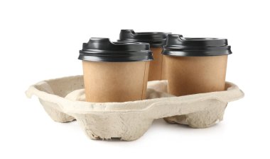 Paper coffee cups in cardboard holder isolated on white