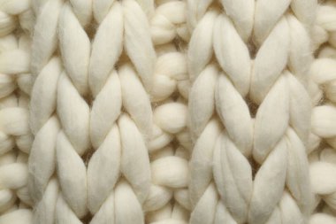 Arka plan olarak beyaz örülmüş yün dokusu, üst görünüm