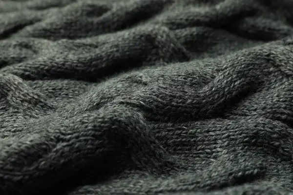 Örülmüş gri yumuşak yün kumaş, yakın çekim görünümü