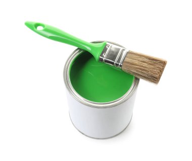 Can of green paint and brush isolated on white