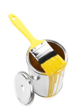 Can of yellow paint and brush isolated on white