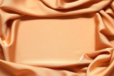 Arka plan olarak güzel buruşmuş ipek kumaş, üst manzara. Metin için boşluk