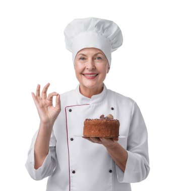 Profesyonel pasta şefi beyaz arka planda iyi bir jest gösteriyor.