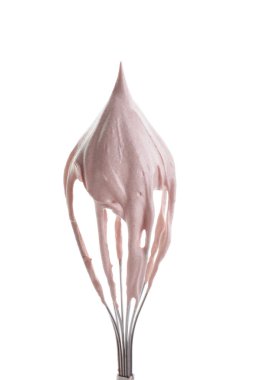 Whisk with delicious cream isolated on white