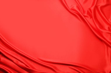 Romantik dekor. Arka plan olarak buruşuk kırmızı ipek kumaş, üst manzara. Metin için boşluk