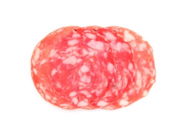 Slices of tasty smoked sausage on white background, top view