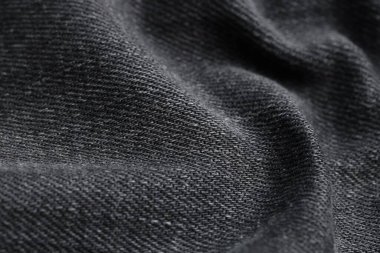 Arka plan olarak siyah kot kumaşın dokusu, yakın plan