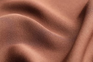 Arkaplan olarak kahverengi kumaşın dokusu, yakın plan