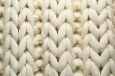 Arka plan olarak beyaz örülmüş yün dokusu, üst görünüm