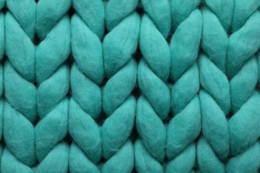 Arka plan olarak turkuaz örülmüş yün dokusu, üst görünüm