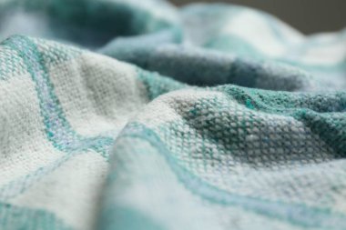 Arkaplan olarak turkuaz yün kumaş, yakın görünüm
