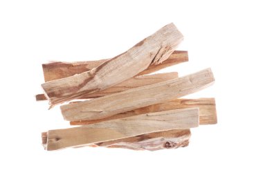 Pile of palo santo sticks in air on white background, top view