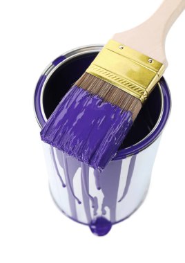 Can of violet paint and brush isolated on white