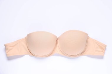 Beyaz arka planda bir bej sütyen, üst görünümde.