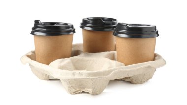 Paper coffee cups in cardboard holder isolated on white