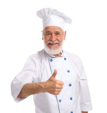 Profesyonel pasta şefi beyaz arka planda baş parmak gösteriyor.