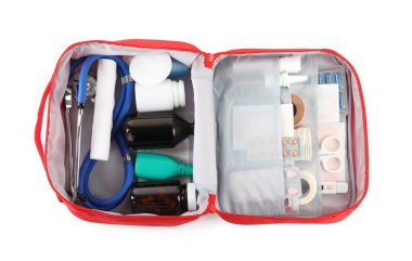 First aid kit. Different medical supplies in bag isolated on white, top view