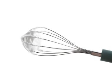 Whisk with delicious cream isolated on white