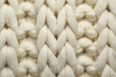 Arka plan olarak beyaz örülmüş yün dokusu, üst görünüm