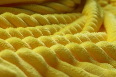 Parlak sarı yumuşak yün kumaş, yakın plan görünüm