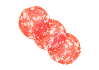 Slices of tasty smoked sausage on white background, top view