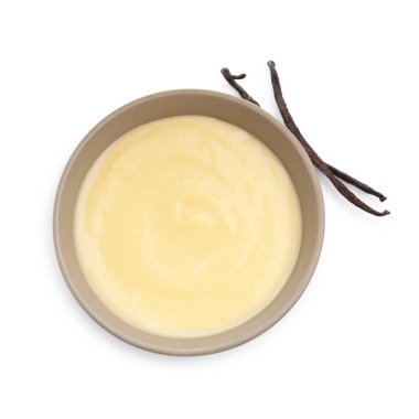 Lezzetli vanilyalı puding ve beyaz kapsüller, üst manzara.