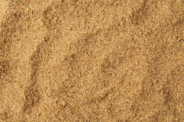 Süper yemek. Arka plan olarak kişniş tozu, üst görünüm