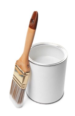 Open can of paint and brush isolated on white