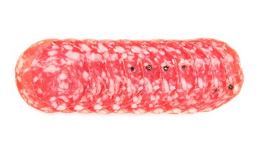 Slices of tasty smoked sausage on white background, top view