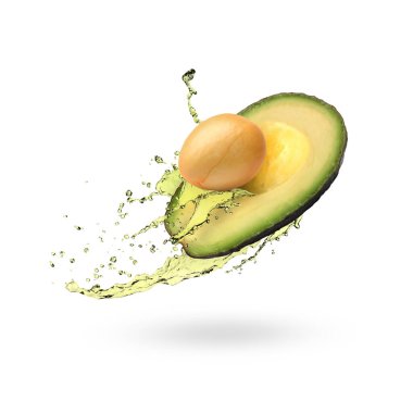 Avokado ve yağın yarısı beyaz zemine sıçrıyor.