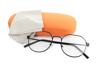 Case with stylish glasses and cleaning cloth isolated on white