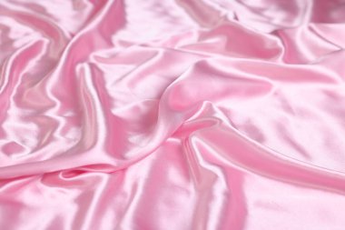 Arka plan olarak lüks pembe ipek çarşaflar, yakın plan